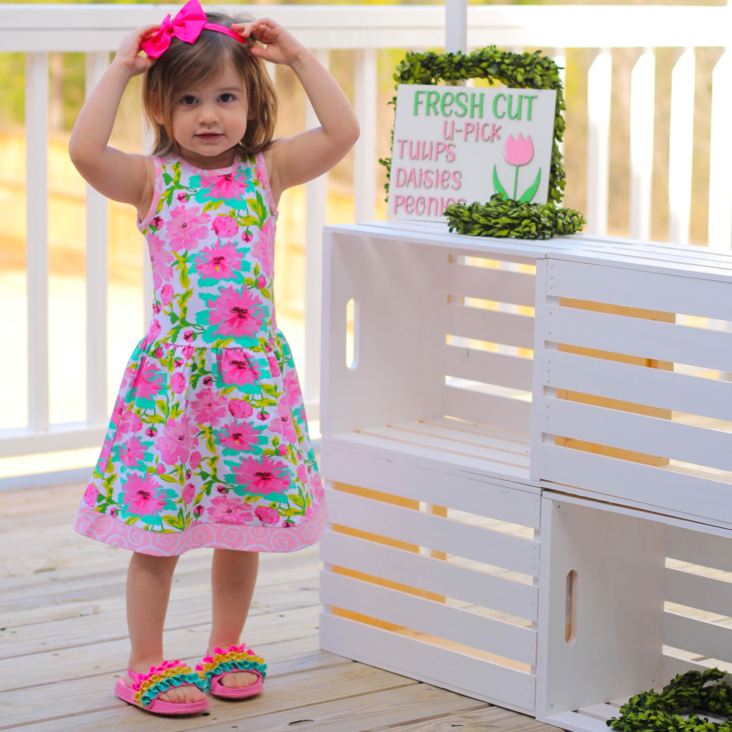 AnnLoren Little & Big Girls Floral Dress in green and pink, showcasing a vibrant floral pattern and sleeveless design, perfect for spring and summer.